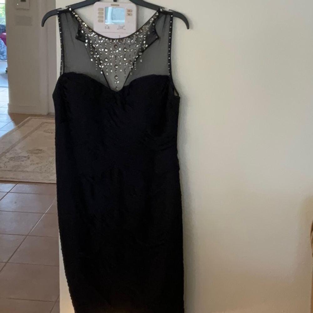 Elegant Black Sleeveless Dress with Embellished Neckline